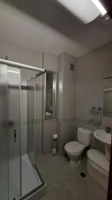 a bathroom with a toilet and a shower and a sink at Апартаменты с одной спальней Carolina in Sunny Beach