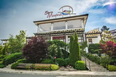 a building with a bench in front of it at Santa Marina, Lovely 1-bedroom apartment in Sozopol
