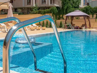 a swimming pool with a slide in a hotel at HORIZON 9 'Б' Apartment Sveti Vlas in Sveti Vlas