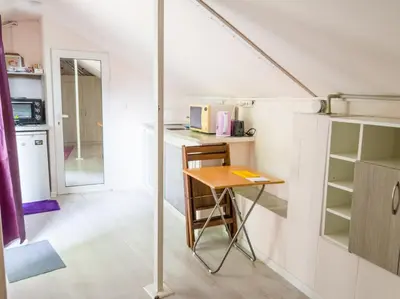 a small kitchen with a table in a room at YES Varna Studios in Varna City