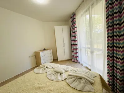 a bedroom with a bed with two pillows on it at HORIZON 4 'Б' Apartment Sveti Vlas in Sveti Vlas