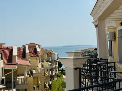 a row of houses with the ocean in the background at HORIZON 33 'Б' Studio Sveti Vlas in Sveti Vlas