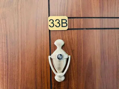 a wooden door with a door knocker on it at HORIZON 33 'Б' Studio Sveti Vlas in Sveti Vlas