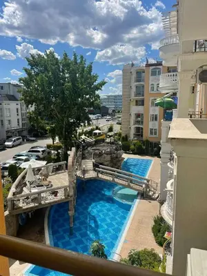 a view of a pool from a balcony of a resort at Sweety SP apartments in Sunny Beach