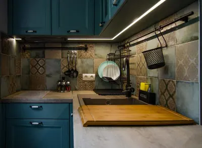 a kitchen with blue cabinets and a sink at Apartment Bellissima 2 minutes away from the beach in Nesebar