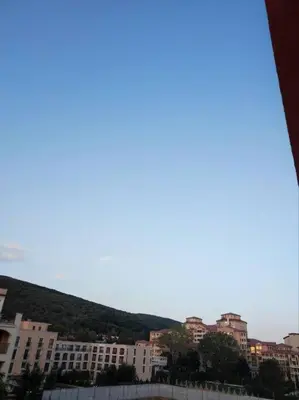 a view of a city with buildings and a hill at Привилидж первая линия in Sveti Vlas