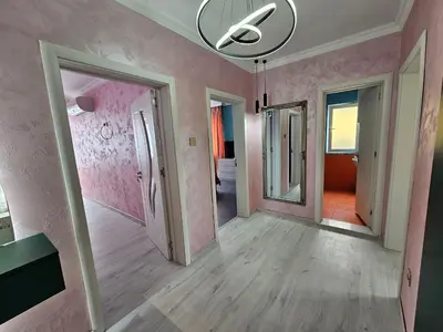 an empty room with pink walls and a mirror at Апартамент Елинор in Pomorie