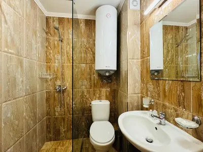 a bathroom with a toilet and a sink at HORIZON 11 'В' Studio Sveti Vlas in Sveti Vlas