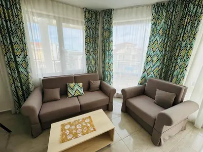 a living room with two couches and a coffee table at HORIZON 9 'В' Apartment Sveti Vlas in Sveti Vlas