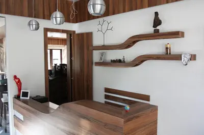 a room with wooden shelves on the wall at Milano Hotel in Burgas City