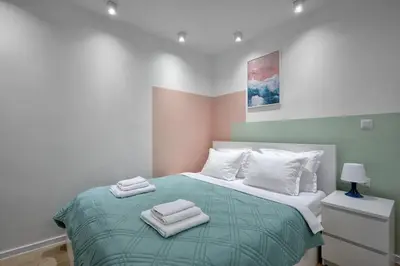 a bedroom with a bed with two towels on it at Sea Moreto Studio 1 in Burgas City