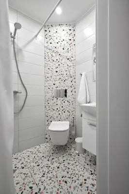 a white bathroom with a toilet and a shower at Sea Moreto Apartment 2 in Burgas City