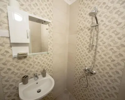 a bathroom with a sink and a shower at Aleks Top Center 2- Free parking in Burgas City