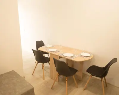a dining room table with four chairs around it at Aleks Top Center 2- Free parking in Burgas City