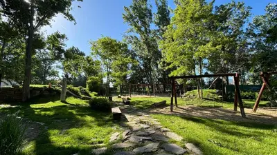 a park with a swing set in the grass at Studio/free yoga&aqua aerobic in Sunny Beach