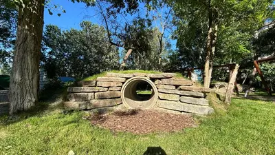 a stone oven in the grass in a park at Studio/free yoga&aqua aerobic in Sunny Beach