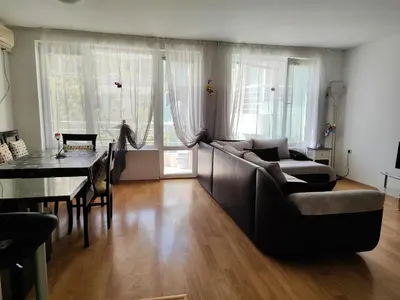a living room with a couch and a table at Nev in Burgas City