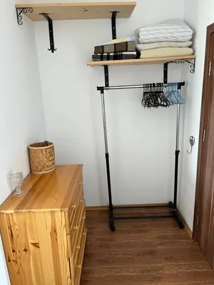 a room with a shelf and a wooden table at Summer Rose Studio by the Sea in Byala