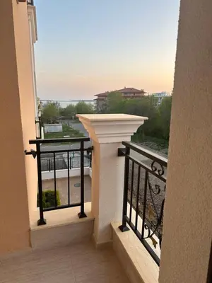 a balcony with a view of a building at Premium Ferienwohnung SWETI WLAS Polarstar Beach Luxury Apartment 150 m zum Strand Pool 3 Balkone Meeresblick Google TV bis zu 6 Personen in Sveti Vlas