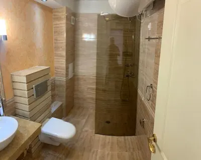 a bathroom with a shower and a toilet and a sink at Penthouse Happy Moments 4 in Sunny Beach