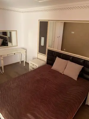 a bedroom with a large bed and a desk at Penthouse Happy Moments 4 in Sunny Beach