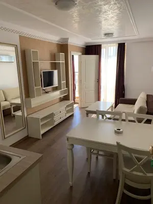 a large living room with a couch and a table at Penthouse Happy Moments 4 in Sunny Beach