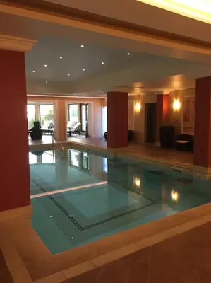 a large swimming pool in a large house at STUNNING VILLA with PRIVATE POOL in Kableshkovo