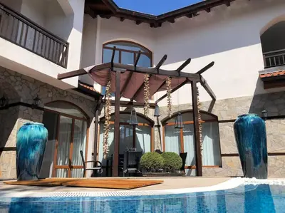 a house with a swimming pool with blue vases at STUNNING VILLA with PRIVATE POOL in Kableshkovo