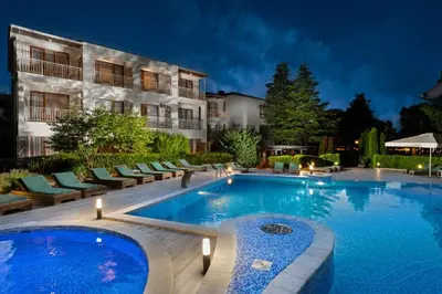 a swimming pool in front of a building at PARADISE Bay Hotel in Sozopol
