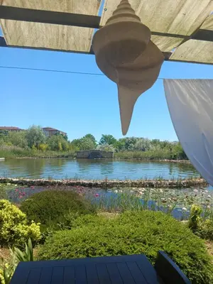 a view of a river from under a roof at One-room boutique at Sunrise All Suites in Obzor