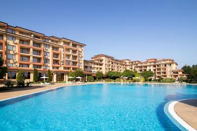 a large swimming pool in front of some apartment buildings at Magic Dreams Apartments in Sveti Vlas