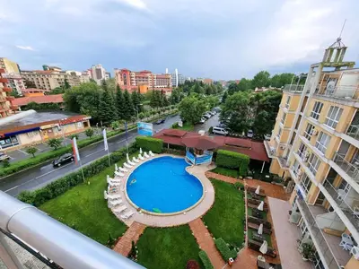 an overhead view of a swimming pool in a city at Reina Apart Flores Park in Sunny Beach