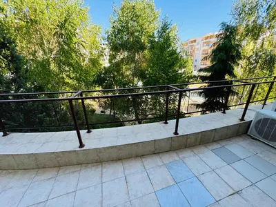 a metal railing on a balcony with trees at SUN VILLAGE B 320 Apartment Sunny Beach in Sunny Beach