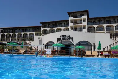 a large swimming pool in front of a hotel at ВОДЕНИЦАТА 2-6 Apartment Sveti Vlas in Sveti Vlas