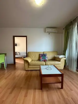 a living room with a couch and a coffee table at Tania's Home in Sunny Beach