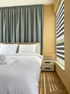 a bedroom with a white bed and a window at Artistic Apartment for 4 Guests in Burgas in Burgas City