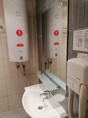 a bathroom with a sink and a mirror at Avalon studio,Sunny Beach in Sunny Beach
