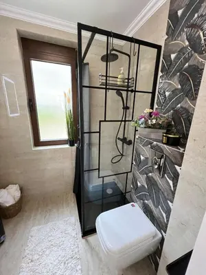 a bathroom with a shower with a toilet and a window at Dolce Vita Premium Apartment Panorama Sea View in Sveti Vlas