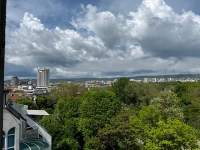 a view of a city under a cloudy sky at Glarus Apartment with Infinity Sea View in Varna City