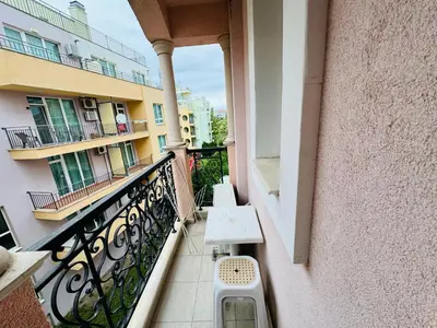 a balcony of a building with a bench on it at ROMANCE MARIN 410 Studio Sunny Beach in Sunny Beach
