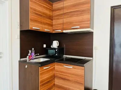 a small kitchen with a sink and a microwave at ROMANCE MARIN 410 Studio Sunny Beach in Sunny Beach