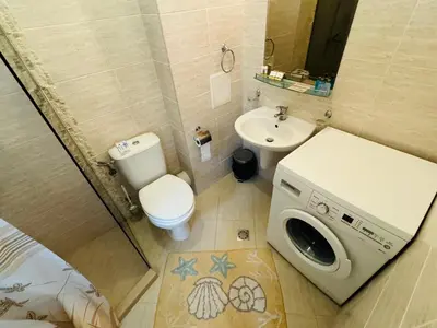 a small bathroom with a toilet and a sink at ROMANCE MARIN 410 Studio Sunny Beach in Sunny Beach