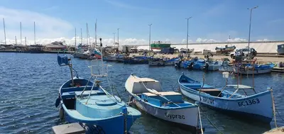 a group of boats docked in the water at K&K Sunset in Burgas City