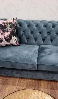 a blue leather couch in a living room at Anabel Home in Burgas City