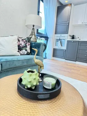 a living room with a table with a bird on it at Anabel Home in Burgas City