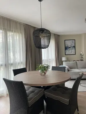 a living room with a table and chairs at Varna City Center Apartment in Varna City