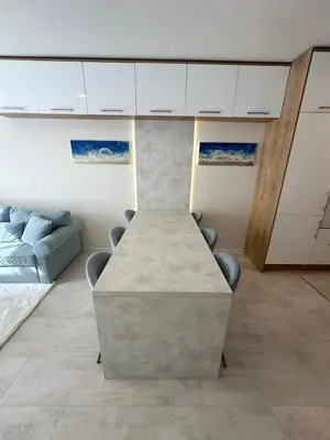 a conference room with a table and a couch at Pool apartment on the beach in Burgas City
