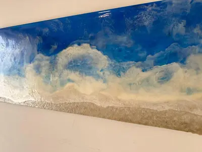 a painting of a cloudy sky on a wall at Pool apartment on the beach in Burgas City