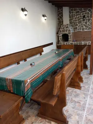 a large altar with wooden benches in a room at Лятна вила Генчеви град Обзор in Obzor