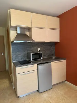 a kitchen with a sink and a microwave at River Park Studio in Sunny Beach